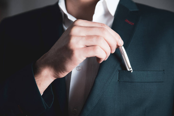 business man hand pen in suit pocket  - Zdjęcie, obraz