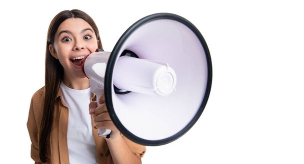 photo of shocked teen girl announcer hold loudspeaker. teen girl announcer with loudspeaker isolated on white. teen girl announcer hold loudspeaker in studio. teen girl announcer with loudspeaker. - Photo, Image