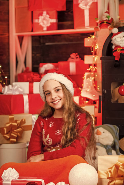Santaland Diaries. cute playful christmas elf. little girl red santa hat. santa claus residence. present delivery service. too much gifts. big sale at holiday shopping. gift shop. happy winter. - 写真・画像
