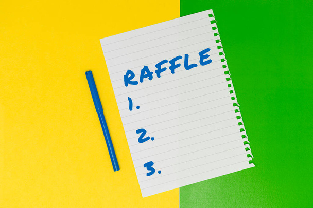 Writing displaying text Raffle, Business overview means of raising money by selling numbered tickets offer as prize - Photo, Image