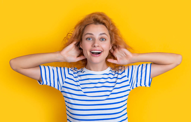amazed redhead girl hear isolated on yellow background. young redhead girl hear sound in studio. adult redhead girl hear. - Foto, imagen