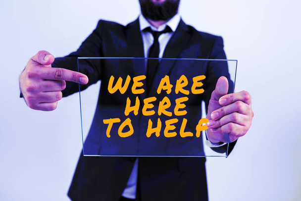 Sign displaying We Are Here To Help, Conceptual photo Someone who is always ready to Assist Support Give - Photo, Image