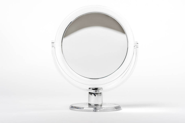 Round table mirror for makeup isolated on white background. - Zdjęcie, obraz