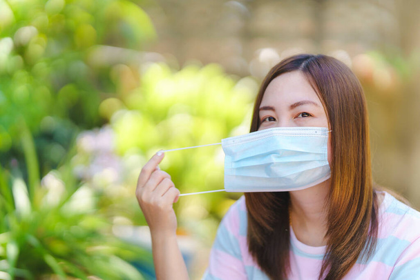Thai women wearing face masks to prevent contagious diseases or prevent air pollution. Health care concept. - Photo, Image