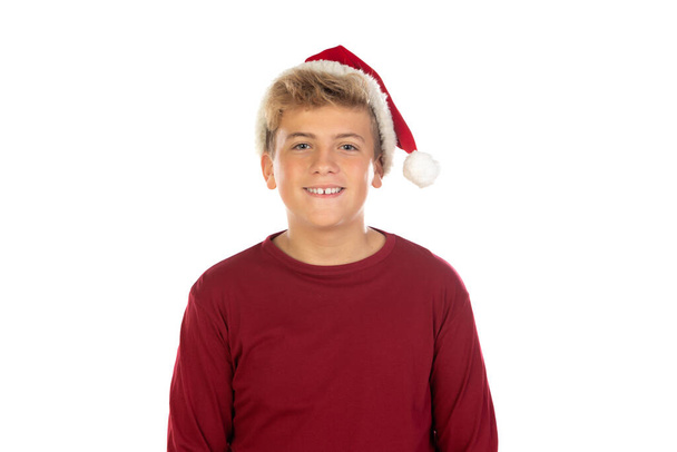 Niño adolescente de Navidad en Santa sombrero rojo aislado sobre fondo blanco. Feliz Navidad y Año Nuevo.  - Foto, imagen