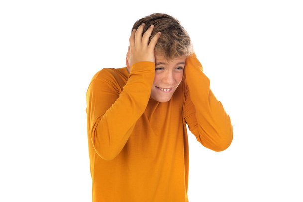 Teenager in orange t-shirt on a white background  - Foto, imagen