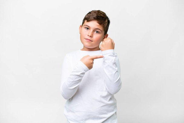 Little caucasian kid over isolated white background making the gesture of being late - Photo, Image