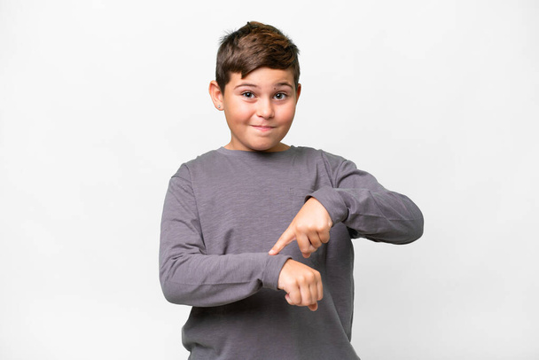 Little caucasian kid over isolated white background making the gesture of being late - 写真・画像