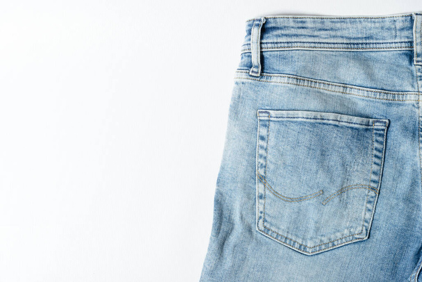 Close up shot back pocket of a blue jeans. - Foto, Imagem