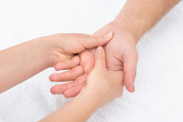 Physiotherapist Massaging Palm - Foto, immagini
