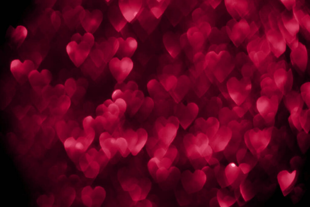 Trendy viva magenta color of the year 2023, pink red hearts, sparkling glitter bokeh background, valentines day abstract defocused texture - Photo, Image