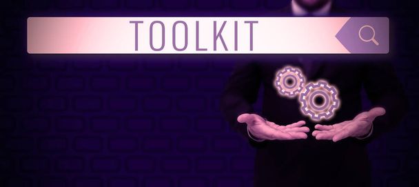 Signo de texto que muestra Toolkit, conjunto de herramientas de ideas de negocios guardadas en una bolsa o caja y utilizadas para un propósito particular - Foto, imagen