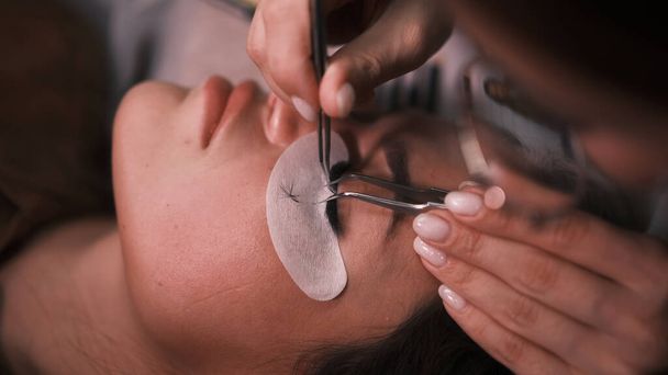 Beautician removes eyelashes that were glued badly - Photo, Image