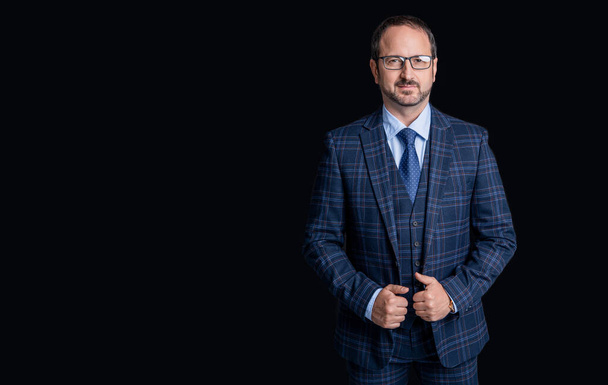 photo of business man in suit, copy space. mature business man isolated on black background. business man in studio. business man wear jacket and tie. - Foto, afbeelding