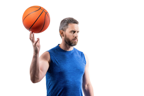 sporty sport man basketball player isolated on white background. sport man basketball player in studio. photo of sport man basketball player with ball. sport man basketball player in sportswear. - Foto, afbeelding