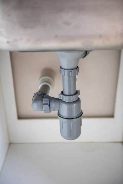 Plastic drain kit for a kitchen sink. - Foto, Imagen