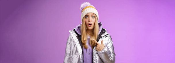 Frustrated shocked speechless stunned blond woman accused widen eyes surrpised questioned look camera pointing herself cannot believe being picked blame victim, standing purple background. - Photo, Image