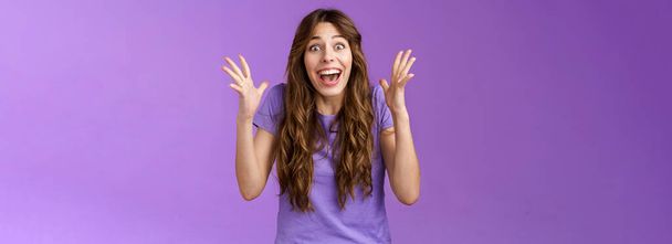 Cheerful surprised happy girl receive unbelievable super prize winning triumphing smiling joyfully shake hands excitement joy celebrating perfect news grinning happily victory purple background. - Photo, Image