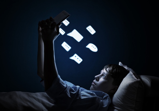 Teenager Reading in bed - Foto, Imagen