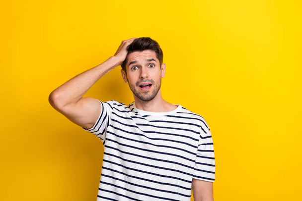 Portrait of shocked speechless person arm touch head open mouth cant believe isolated on yellow color background. - Foto, Bild