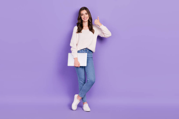 Full length photo of adorable lady user influencer hold gadget share feedback device shop empty space isolated on purple color background. - Zdjęcie, obraz