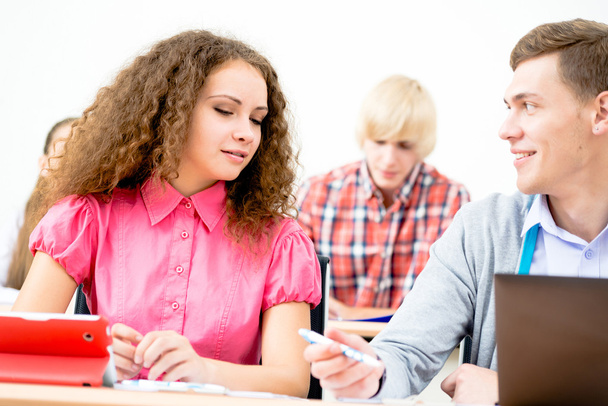 Students  talking in the classroom - Foto, Bild