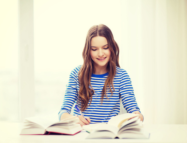 happy smiling student girl with books - Fotó, kép
