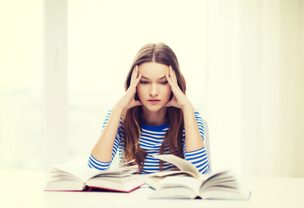stressed student girl with books - Foto, Imagen