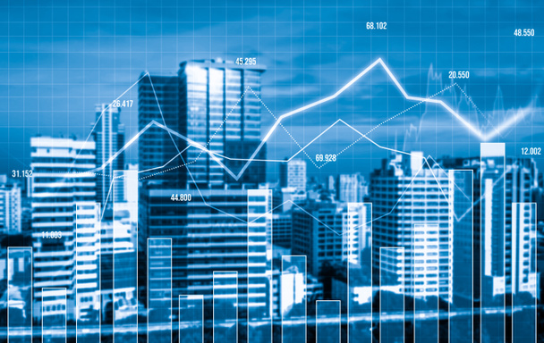 As background for a financial or business concept, digital screen and financial graphs overlap on a picture of modernistic cityscape, skyscrabbers. - Photo, Image