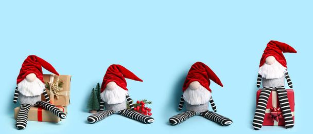 Коллаж милый рождественский гном с подарками и украшениями на синем фоне - Фото, изображение