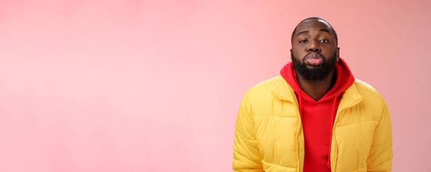Lifestyle. Portrait bored childish cute african bearded 25s male show tongue grimacing making funny faces immature behaviour unwilling grow-up standing pink background mimicking folding lips tube. - Photo, Image