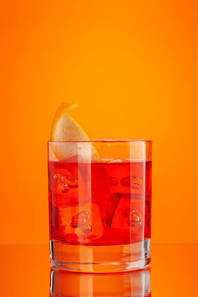 Negroni cocktail on orange background with copy space - Photo, Image