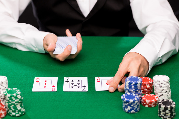 holdem dealer with playing cards and casino chips - Foto, imagen