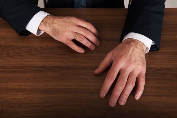 Businessman's hands put on the desk - Photo, image