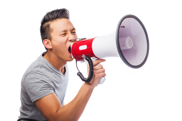 Young asian man with megaphone - Foto, imagen