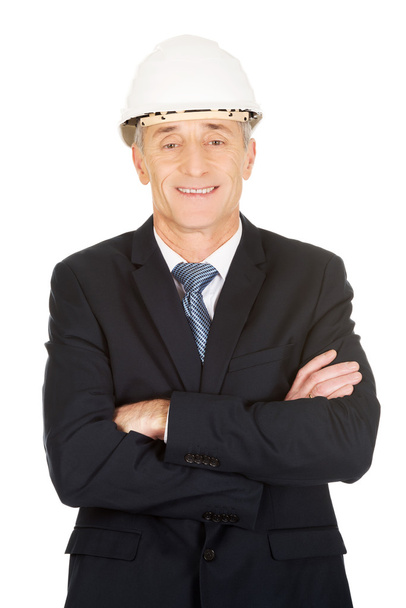 Smiling businessman with hard hat - Foto, Bild