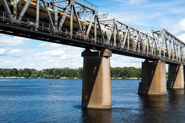 Railroad bridge in Kyiv across the Dnieper with freight train - Photo, Image