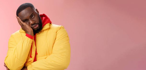 Annoyed bothered pissed african-american bearded man in yellow jacket facepalm look angry camera irritated lean head hand bored fed up pissed hearing uninteresting same stories, pink background. - Fotó, kép