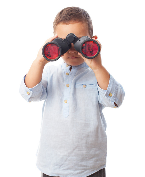 Little boy looking through binoculars - 写真・画像