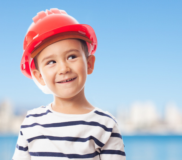Little boy wearing mason helmet - Fotó, kép