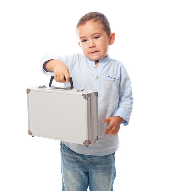 Niño pequeño sosteniendo maletín
 - Foto, Imagen