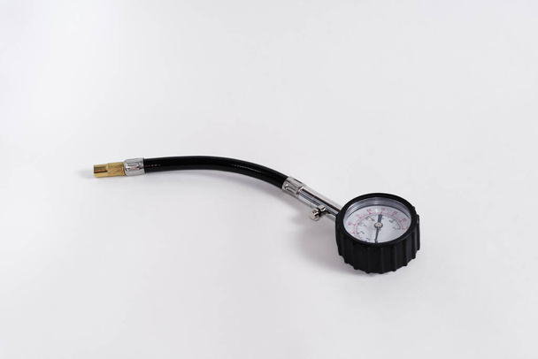 Tire pressure indicator. Close-up. Isolated on white background. - Photo, Image