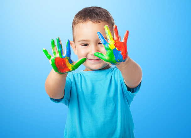 Cute kid playing with paint - Foto, Imagen
