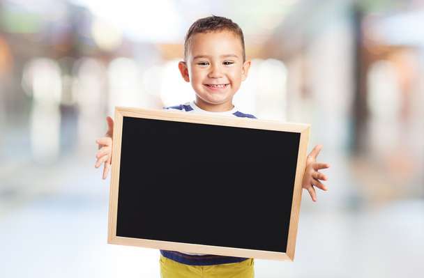 Cute kid holding chalkboard - Φωτογραφία, εικόνα