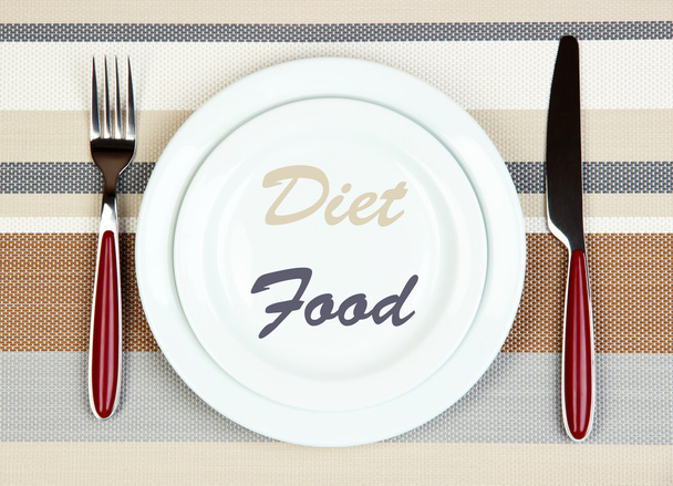Plate with text "Diet Food", fork and knife on tablecloth background - Fotografie, Obrázek