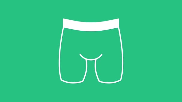 Blanco icono de los pantalones cortos de ciclismo aislado sobre fondo verde. Animación gráfica de vídeo 4K. - Metraje, vídeo