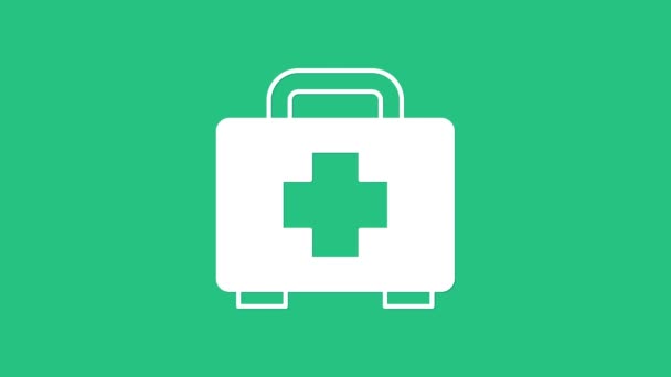 Белый значок аптечки на зеленом фоне. Медицинская коробка с крестом. Медицинское оборудование для чрезвычайных ситуаций. Концепция здравоохранения. Видеографическая анимация 4K. - Кадры, видео