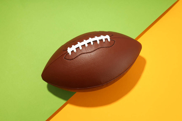 American football ball on two tone background - Φωτογραφία, εικόνα