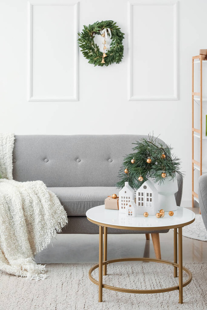Interior of living room with house shaped candle holders and Christmas wreath - Photo, Image