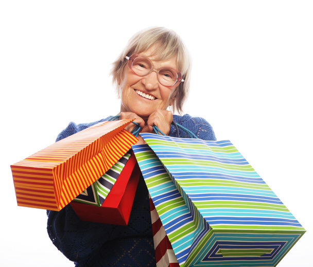 Happy senior woman with shopping bags - Foto, Imagem